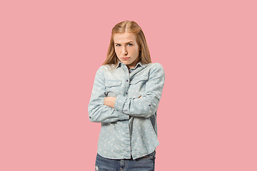 Image showing Portrait of an angry woman looking at camera isolated on a pink background