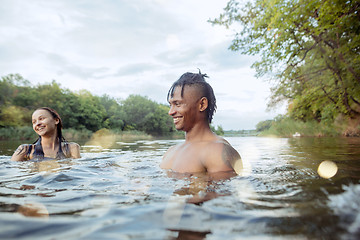 Image showing Enjoying river party with friends. Group of beautiful happy young people at the river together