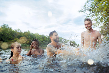 Image showing Enjoying river party with friends. Group of beautiful happy young people at the river together