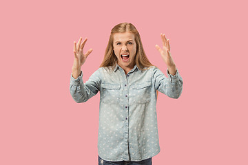 Image showing Portrait of an angry woman looking at camera isolated on a pink background