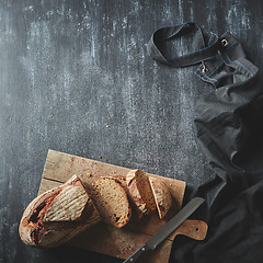 Image showing Sliced bread on wooden board