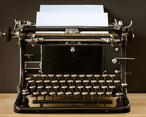 Image showing Vintage typewriter with blank sheet of paper retro technology