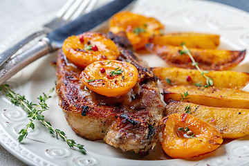 Image showing Pork entrecote with apricots, thyme and potatoes.