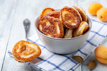 Image showing Homemade pancakes in a clay bowl.