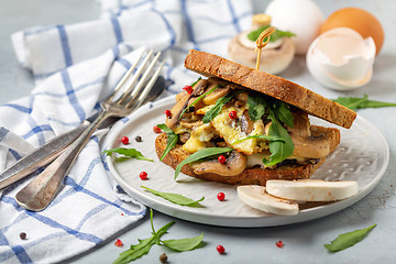 Image showing Breakfast with scrambled eggs and mushrooms on toast.