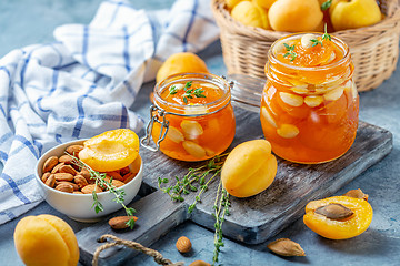 Image showing Homemade apricot jam with thyme and sweet almonds.