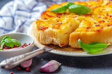 Image showing Piece of tarte tatin pie with potatoes close-up.