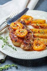 Image showing Entrecote of pork with apricots and thyme.