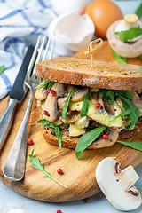 Image showing Toasted bread sandwich with mushrooms and scrambled eggs.
