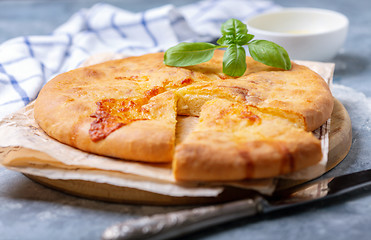 Image showing Closed cheese pie (khachapuri) close-up.