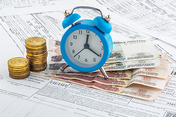 Image showing Watches, paper rubles, coins on receipts with penalties for payment