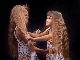 Image showing Girl grabbed another girl by the hair