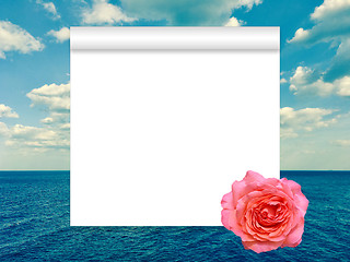 Image showing Scroll, rose and sea