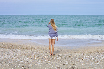 Image showing Beautiful girl in sea style on the Adriatic beach. Travel and va