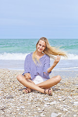 Image showing Beautiful happy girl on the Adriatic beach. Travel and vacation.