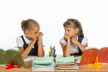 Image showing Sad schoolgirls in class received a deuce, and looked at each other