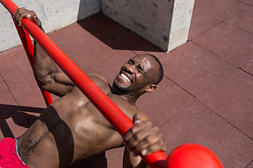 Image showing Athlete doing exercises at stadium