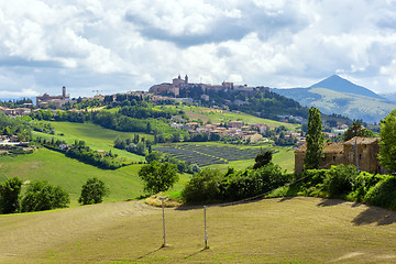 Image showing Camerino in Italy Marche over colourful fields