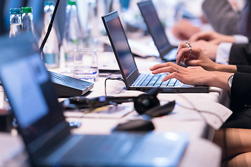 Image showing close up of business people hands using laptop computer