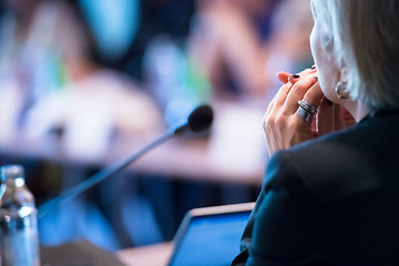 Image showing close up of businesswoman giving presentations at conference roo