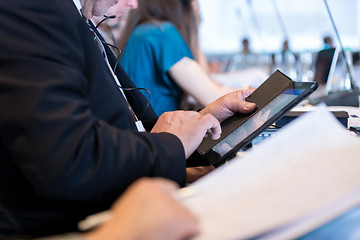 Image showing close up of business people hands using tablet computer