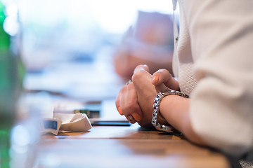 Image showing close up of business people taking notes