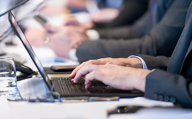 Image showing close up of business people hands using laptop computer