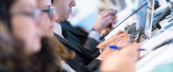 Image showing close up of business people hands using laptop computer