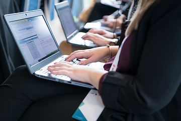 Image showing close up of business people hands using laptop computer