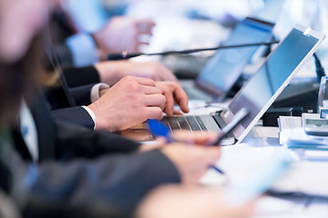 Image showing close up of business people hands using laptop computer