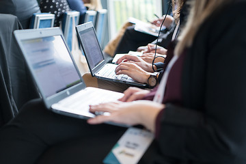 Image showing close up of business people hands using laptop computer