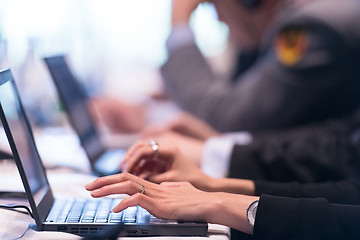 Image showing close up of business people hands using laptop computer