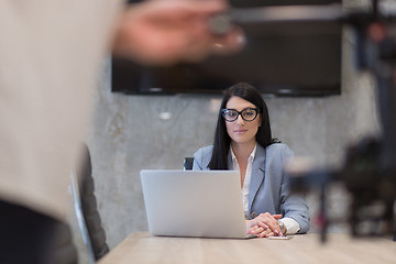 Image showing businesswoman using a laptop in startup office