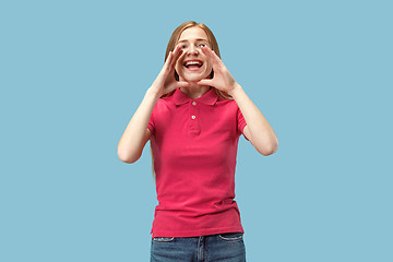 Image showing Isolated on pink young casual woman shouting at studio