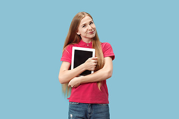 Image showing The happy businesswoman with red laptop on blue