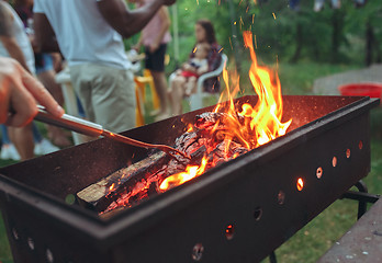 Image showing warm fireplace with lots of trees ready for barbecue