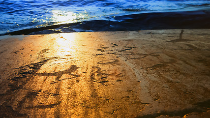 Image showing Prehistoric Petroglyphs In The Sunset Light