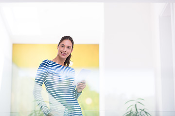 Image showing young woman at home websurfing