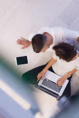 Image showing couple using tablet and laptop computers top view