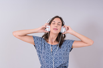 Image showing woman with headphones isolated on a white