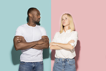 Image showing Young serious thoughtful afro man and woman at studio