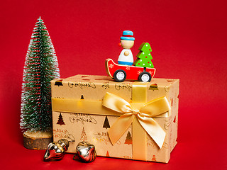 Image showing Christmas decoration gift box with red background