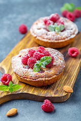 Image showing Delicious mini-tarts (tartlets) with raspberries.