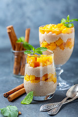 Image showing Rice pudding with peach slices for breakfast.