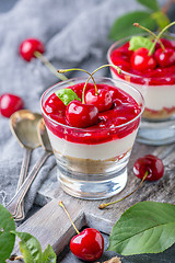 Image showing Cheesecake with cherry jelly in a glass close-up.