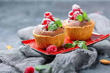 Image showing Tartlets with red raspberries and frangipani.