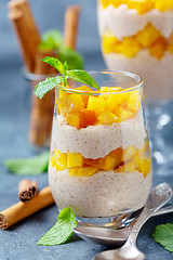 Image showing Rice pudding with peach slices and spices.