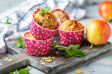 Image showing Homemade muffins with pear and granola.