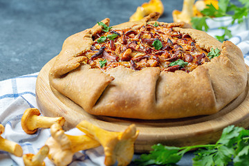 Image showing Traditional pie (Galette) with wild chanterelles.