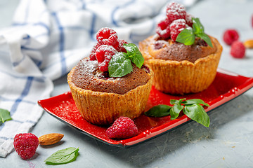 Image showing Mini tarts with raspberry fruit and almond cream.